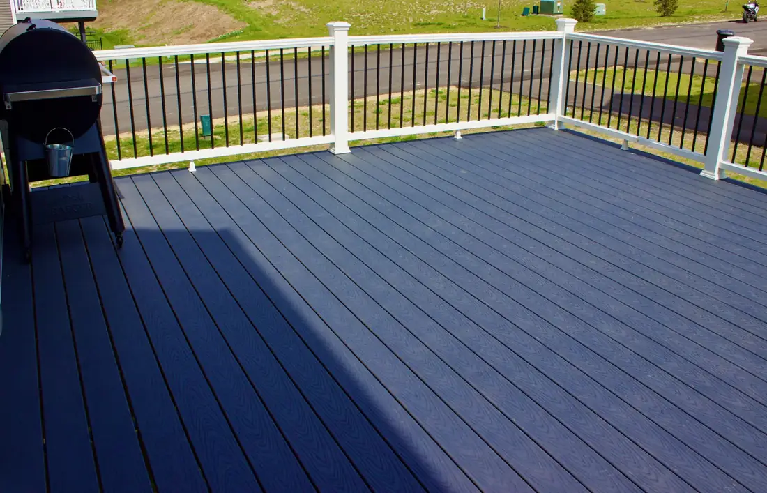 Gray composite surface, white rail — Oasis Custom Decks
