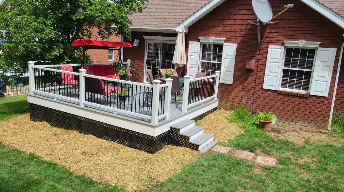 Deck and stairs, brick home — Oasis Custom Decks
