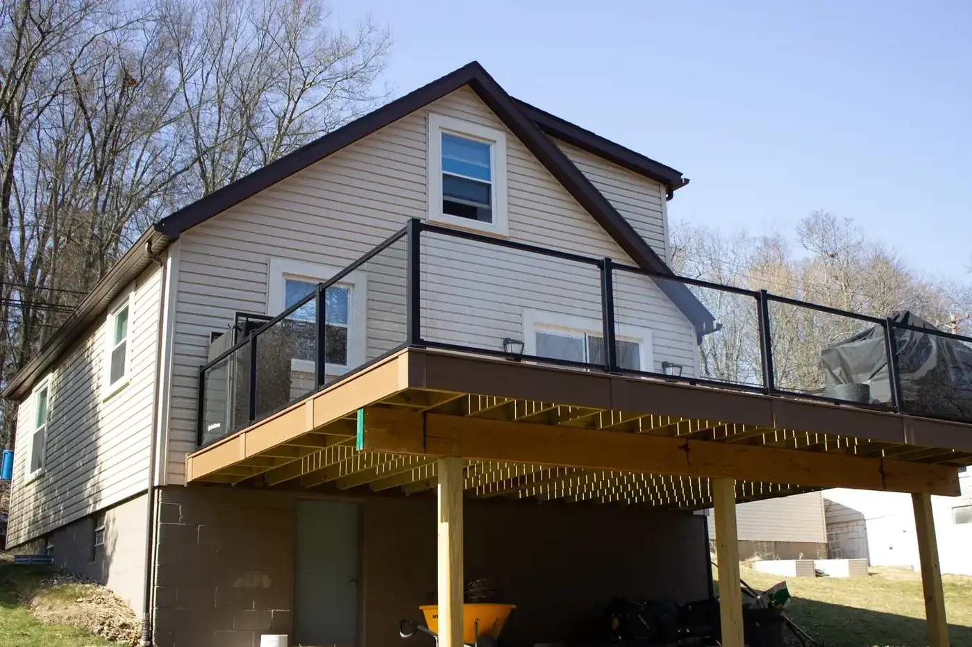 Elevated composite deck with glass railing