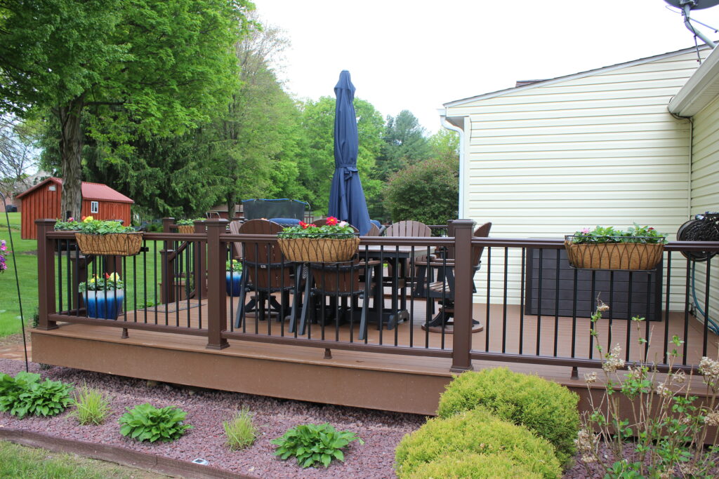 Photo of a fully furnished deck with sofas and a table for activities