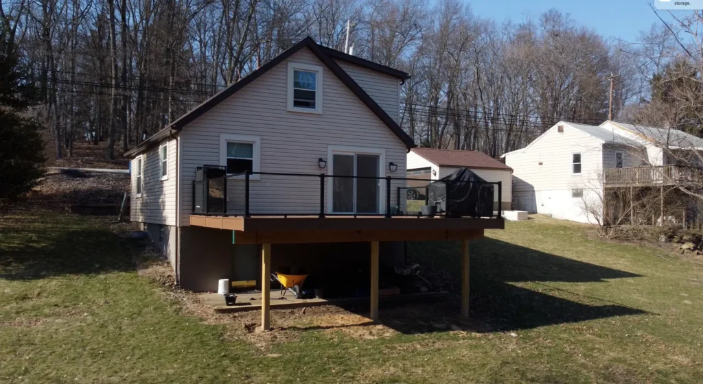 Photo of a raised deck featuring a glass railing