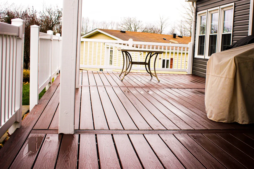 Photo of a house deck with a white railing