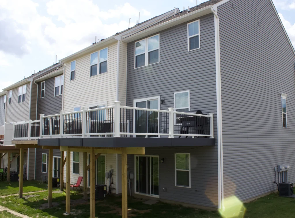 Photo of a raised deck attached to the second floor of a house