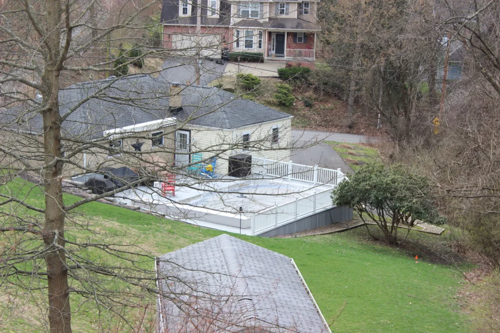 Photo showing a deck under construction that will be installed around a pool