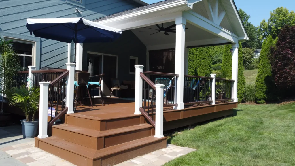 Photo of a beach-style deck from another angle, showing the entire deck along with its furniture and roof
